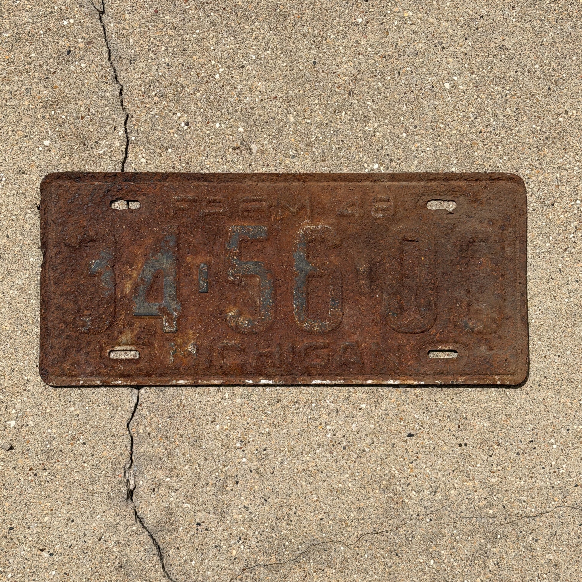 Photo of a 1948 Michigan Farm License Plate Auto Tag Garage Decor Vintage 34 56 00 with original patina