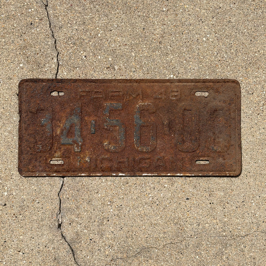 Photo of a 1948 Michigan Farm License Plate Auto Tag Garage Decor Vintage 34 56 00 with original patina