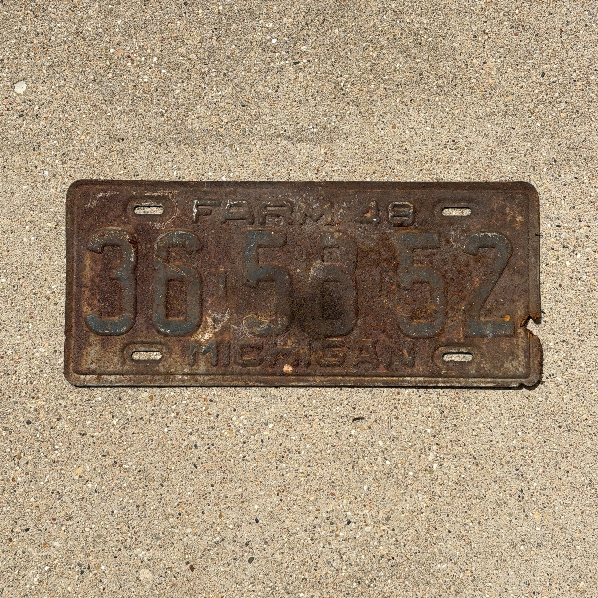 Photo of a 1948 Michigan Farm License Plate Auto Tag Garage Decor Vintage 36 58 52 with original patina