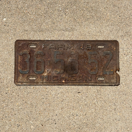 Photo of a 1948 Michigan Farm License Plate Auto Tag Garage Decor Vintage 36 58 52 with original patina