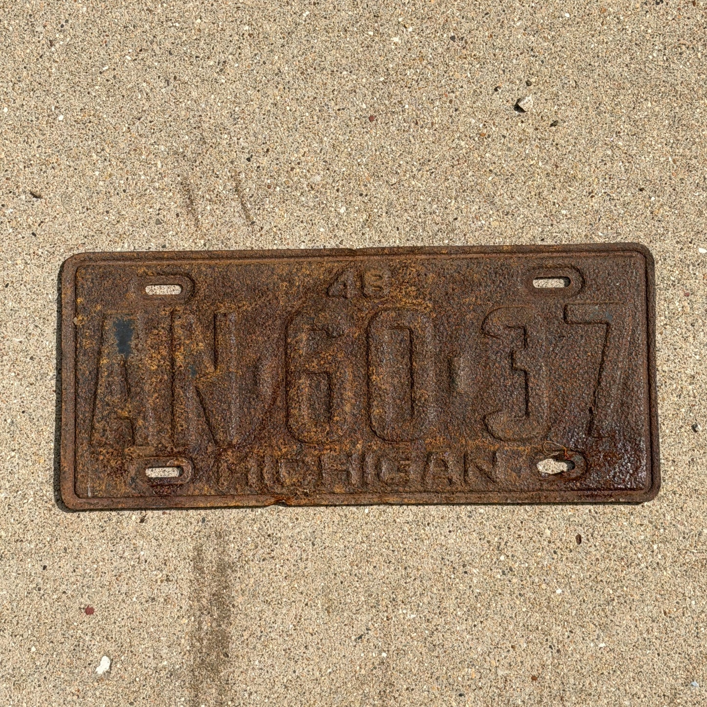 Photo of a 1948 Michigan License Plate Auto Tag Garage Decor Vintage AN 60 37 with original patina