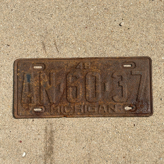 Photo of a 1948 Michigan License Plate Auto Tag Garage Decor Vintage AN 60 37 with original patina