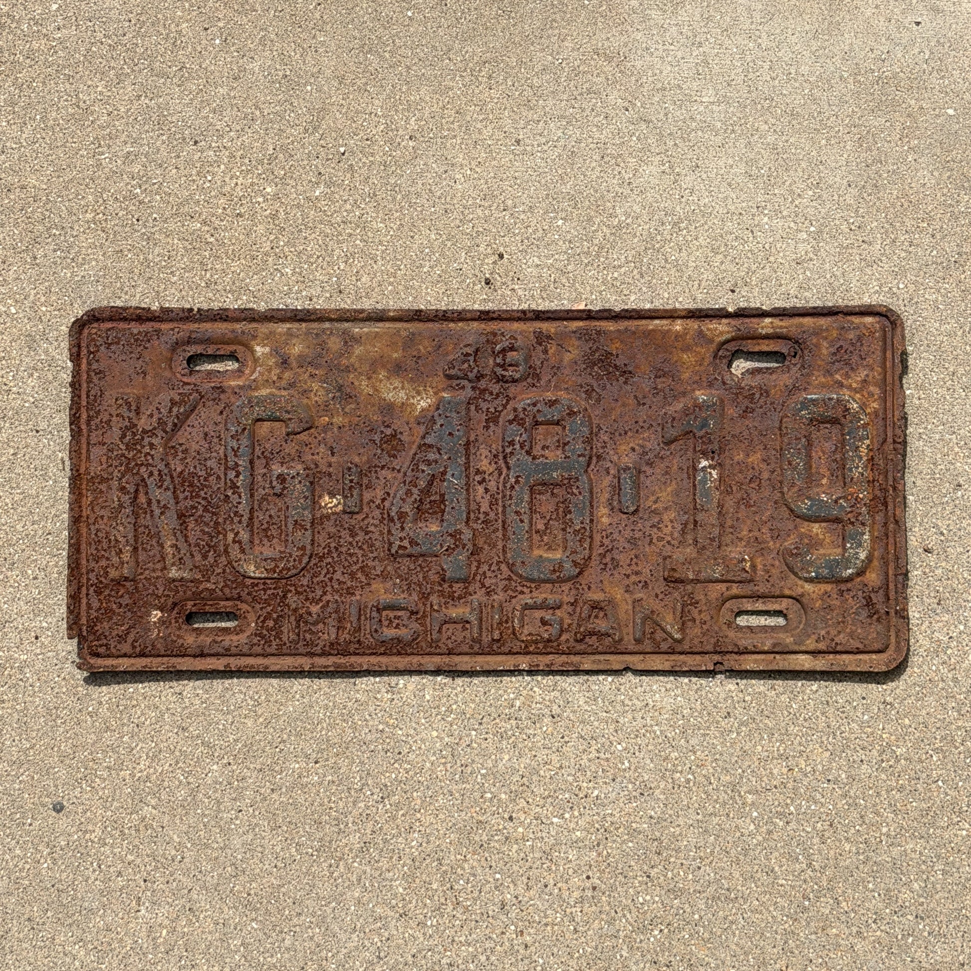 Photo of a 1948 Michigan License Plate Auto Tag Garage Decor Vintage KG 48 19 with original patina