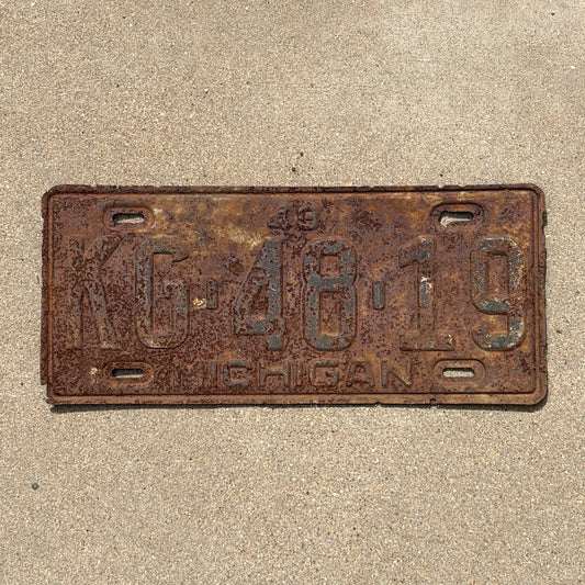 Photo of a 1948 Michigan License Plate Auto Tag Garage Decor Vintage KG 48 19 with original patina