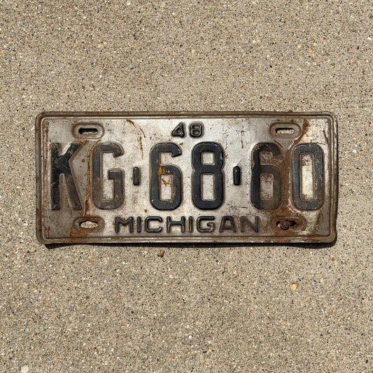 Photo of a 1948 Michigan License Plate Auto Tag Garage Decor Vintage KG 68 60 with original patina