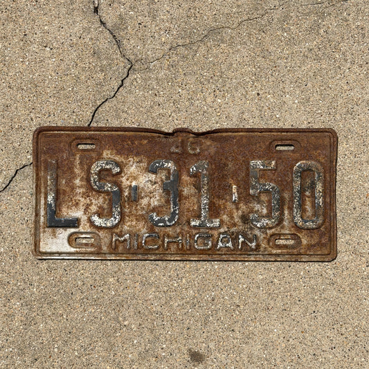 Photo of a 1948 Michigan License Plate Auto Tag Garage Decor Vintage LS 31 50 with original patina