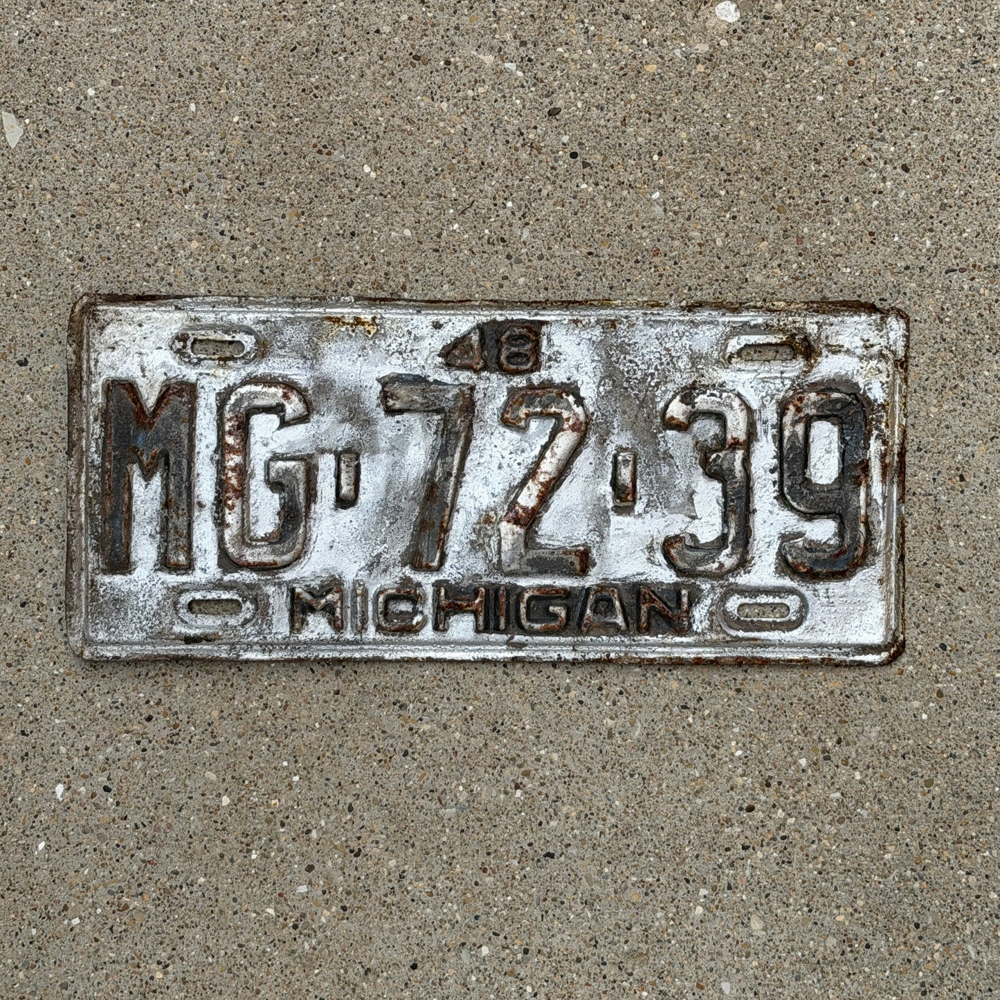 Photo of a 1948 Michigan License Plate Auto Tag Garage Decor Vintage MG 72 39 with original patina