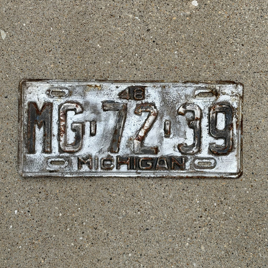 Photo of a 1948 Michigan License Plate Auto Tag Garage Decor Vintage MG 72 39 with original patina