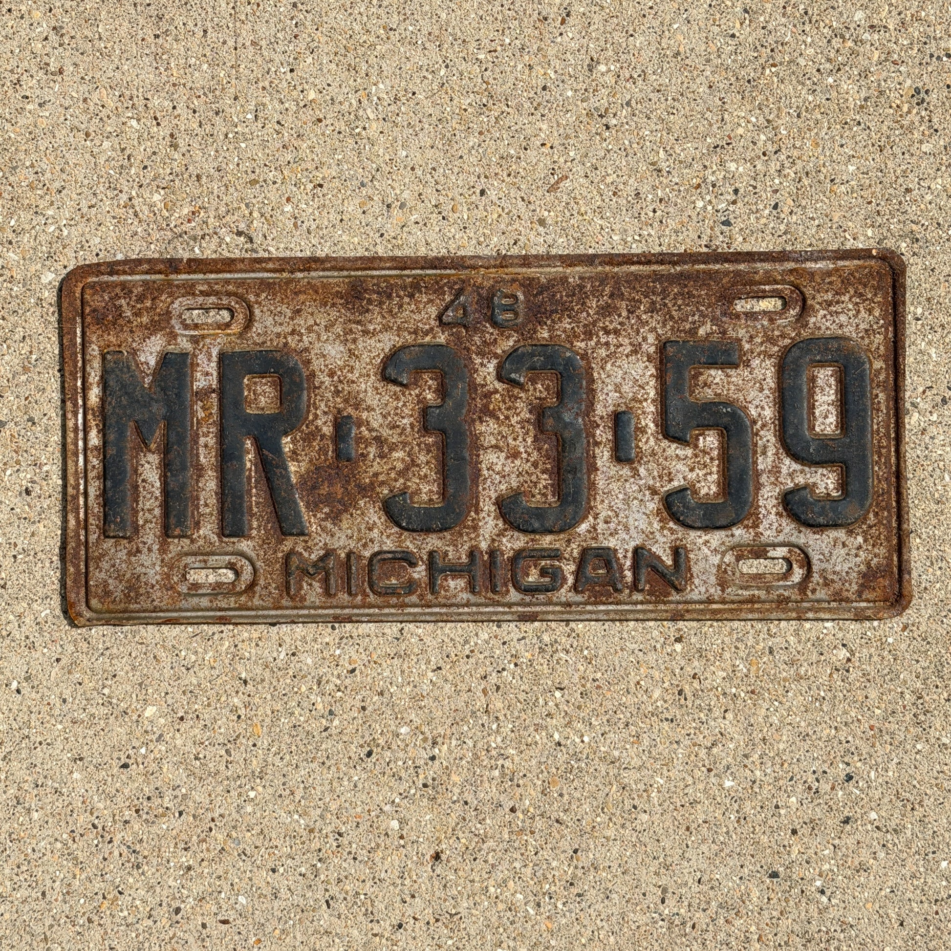 Photo of a 1948 Michigan License Plate Auto Tag Garage Decor Vintage MR 33 59 with original patina
