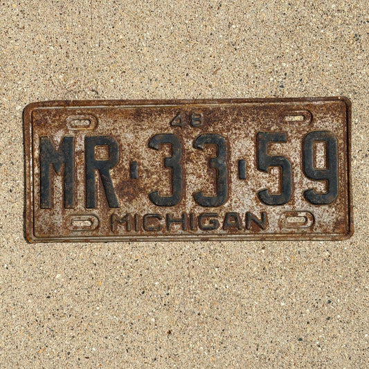 Photo of a 1948 Michigan License Plate Auto Tag Garage Decor Vintage MR 33 59 with original patina