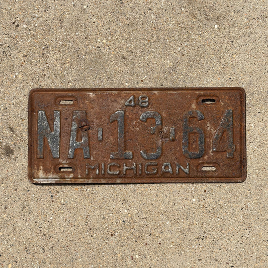 Photo of a 1948 Michigan License Plate Auto Tag Garage Decor Vintage NA 13 64 with original patina
