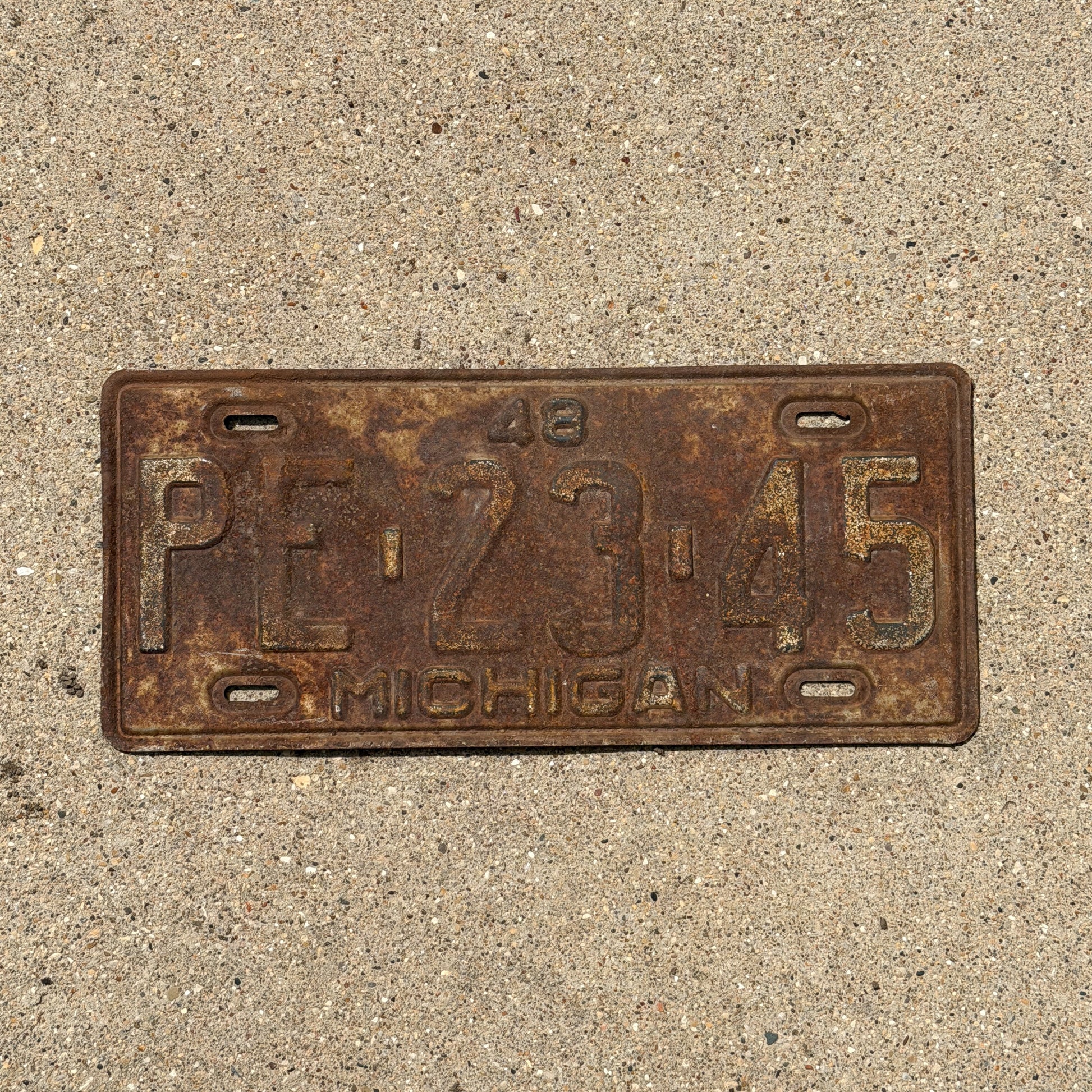 Photo of a 1948 Michigan License Plate Auto Tag Garage Decor Vintage PE 23 45 with original patina