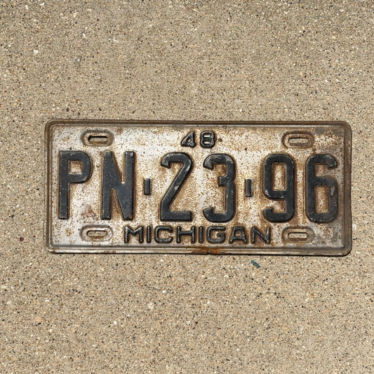 Photo of a 1948 Michigan License Plate Auto Tag Garage Decor Vintage PN 23 96 with original patina