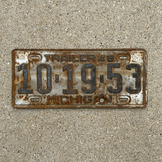 Photo of a 1948 Michigan Trailer License Plate Auto Tag Garage Decor Vintage 10 19 53 with original patina