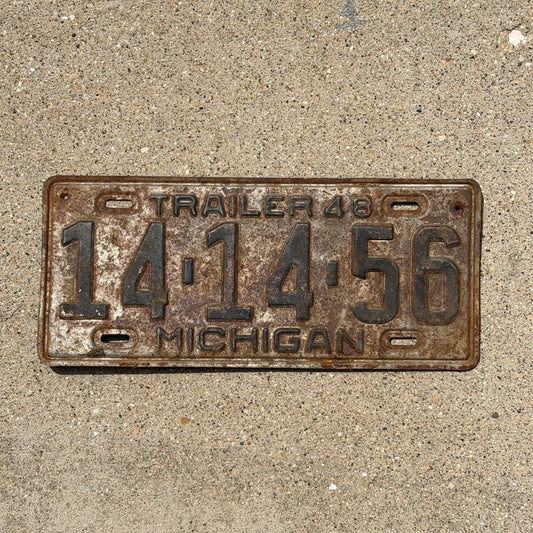 Photo of a 1948 Michigan Trailer License Plate Auto Tag Garage Decor Vintage 14 14 56 with original patina