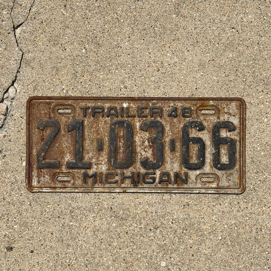 Photo of a 1948 Michigan Trailer License Plate Auto Tag Garage Decor Vintage 21 03 66 with original patina