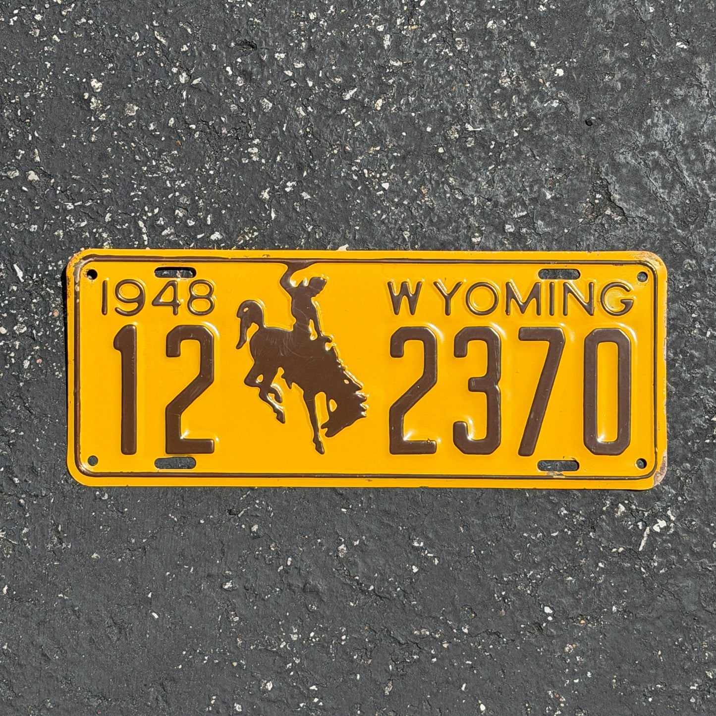 Photo of a 1948 Wyoming License Plate Auto Tag Garage Decor Vintage Cowboy Rodeo 12 2370 with original patina