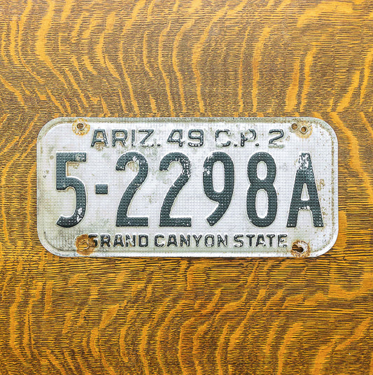 Photo of a 1949 Arizona Commercial License Plate Auto Tag Garage Decor Vintage Waffle Style 5 2298A with original patina