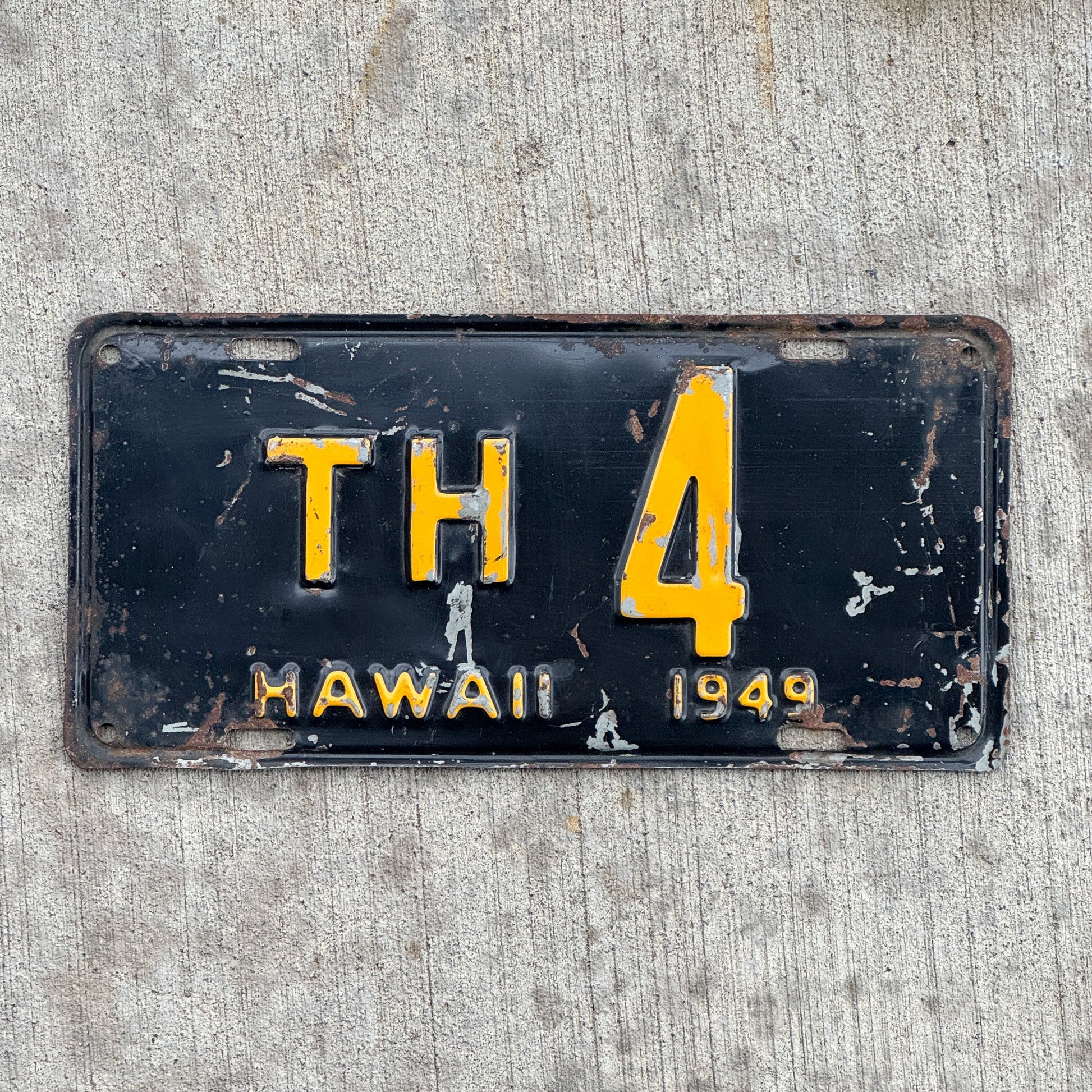 Photo of a 1949 Hawaii License Plate Auto Tag Garage Decor Vintage Territory of HI Pre Statehood Low Number Single Digit TH 4 with original patina