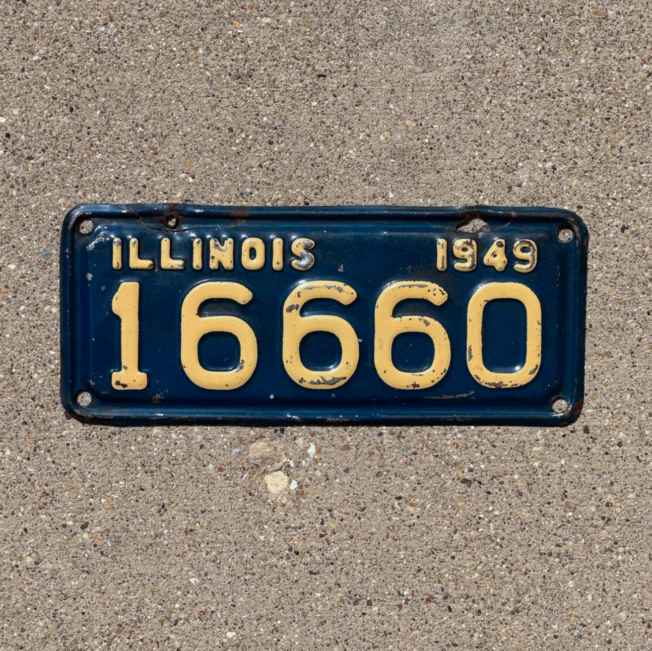 Photo of a 1949 Illinois Motorcycle License Plate Auto Tag Garage Decor Vintage 666 Devil Evil 16660 with original patina