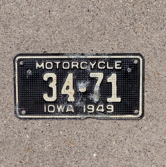 Photo of a 1949 Iowa Motorcycle License Plate Auto Tag Garage Decor Waffle Style Low Number Two Digit Floyd County 34 71 with original patina