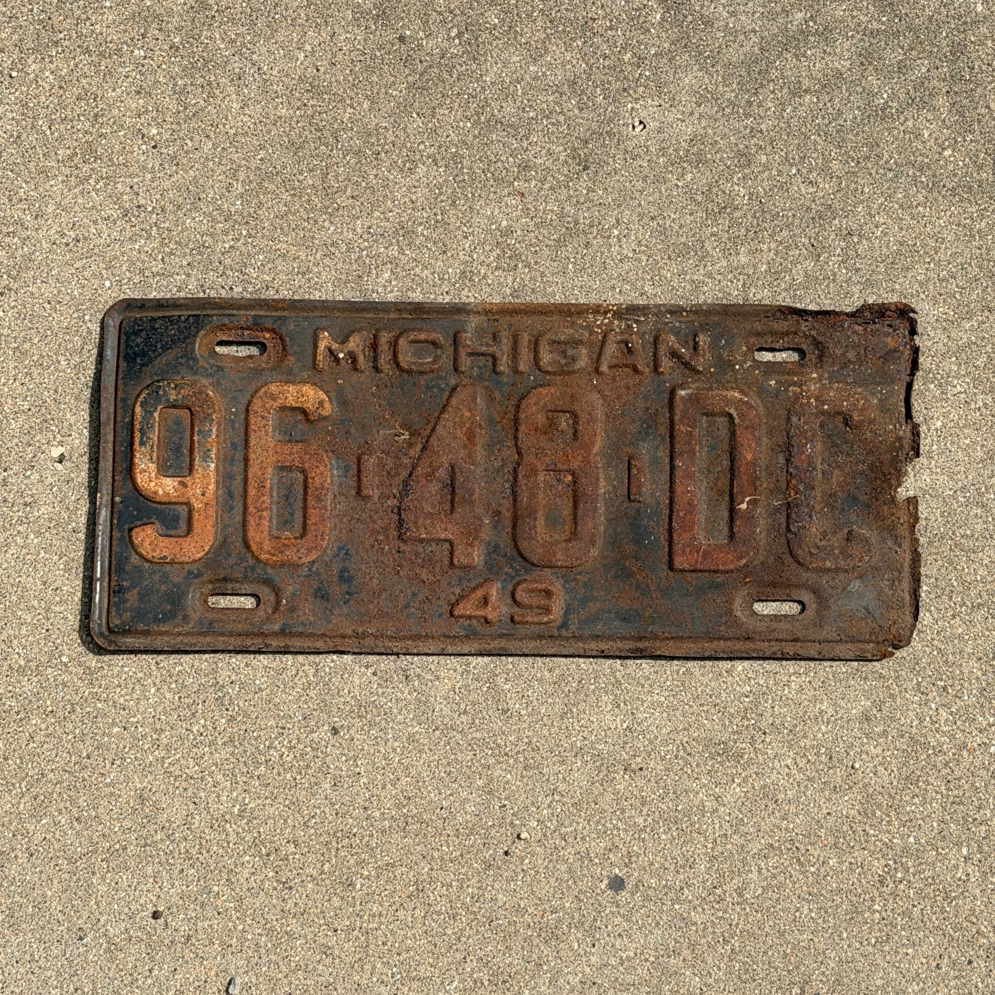 Photo of a 1949 Michigan Commercial License Plate Auto Tag Garage Decor Vintage 96 48 DC with original patina