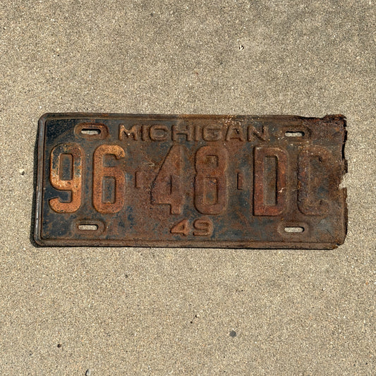 Photo of a 1949 Michigan Commercial License Plate Auto Tag Garage Decor Vintage 96 48 DC with original patina