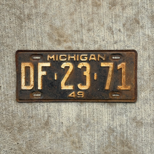 Photo of a 1949 Michigan License Plate Auto Tag Garage Decor Vintage DF 23 71 with original patina