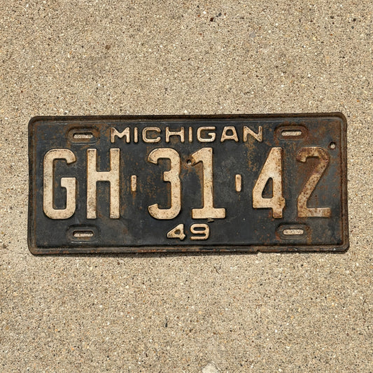 Photo of a 1949 Michigan License Plate Auto Tag Garage Decor Vintage GH 31 42 with original patina