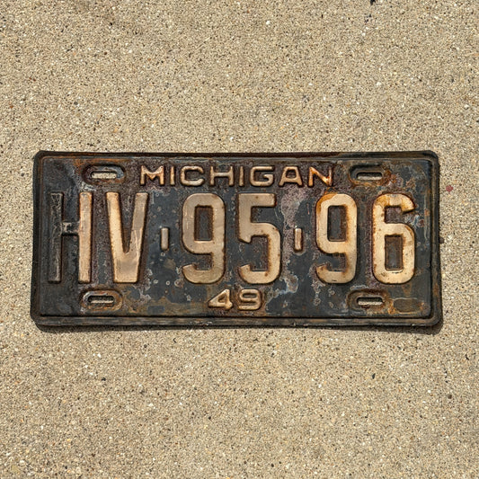 Photo of a 1949 Michigan License Plate Auto Tag Garage Decor Vintage HV 95 96 with original patina