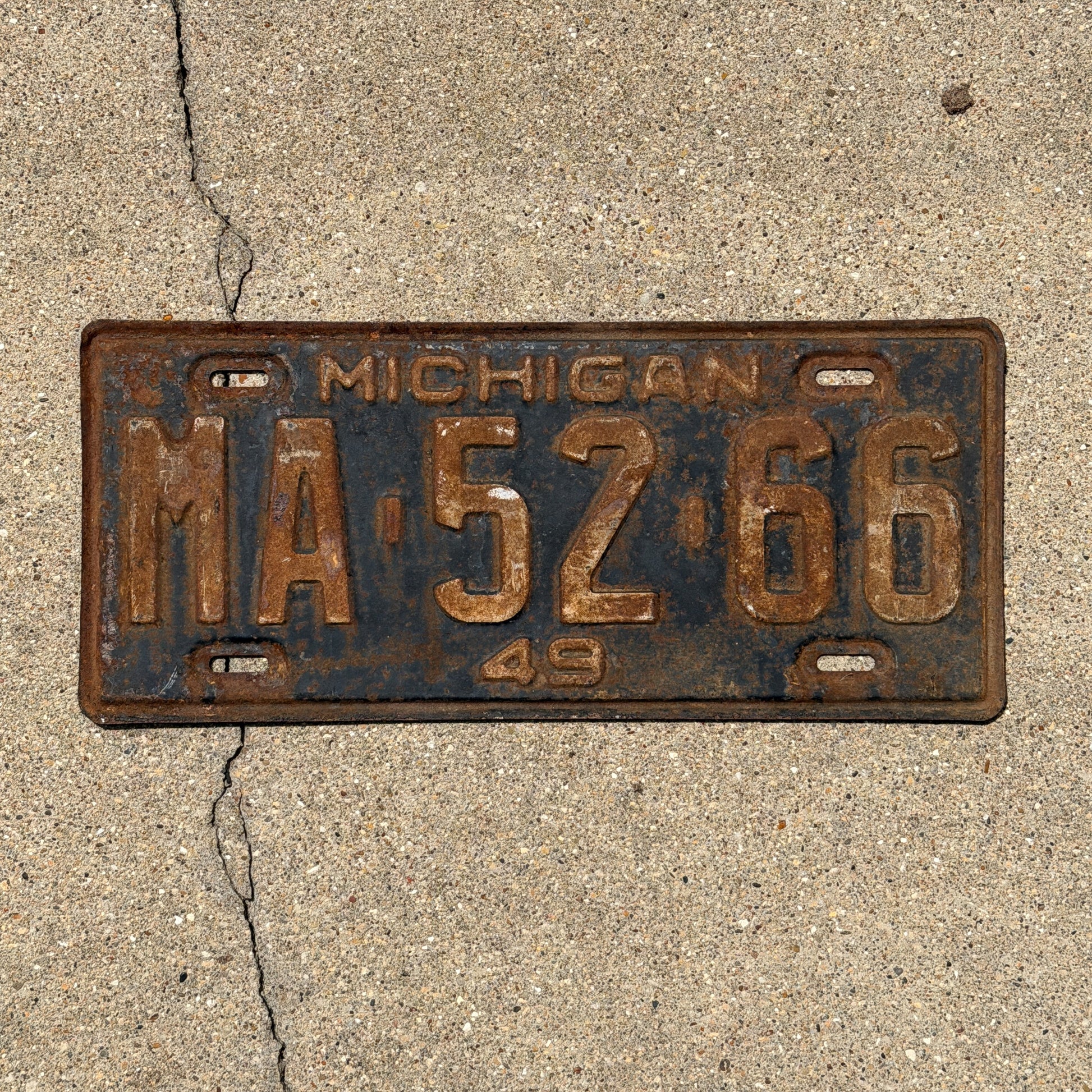 Photo of a 1949 Michigan License Plate Auto Tag Garage Decor Vintage MA 52 66 with original patina