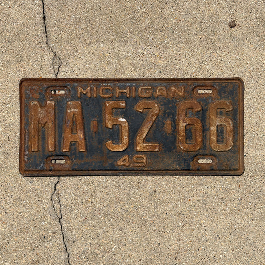 Photo of a 1949 Michigan License Plate Auto Tag Garage Decor Vintage MA 52 66 with original patina