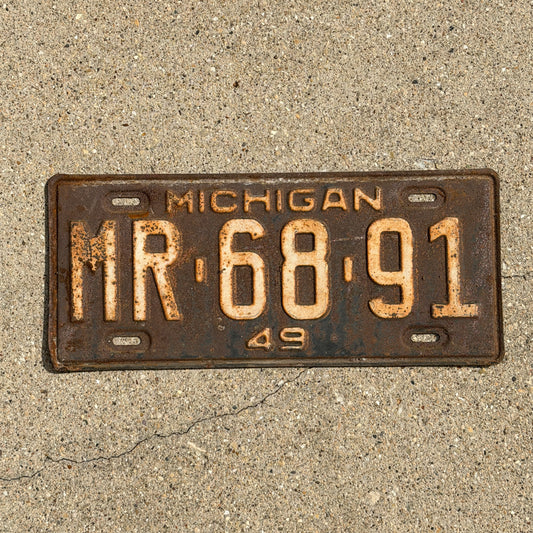 Photo of a 1949 Michigan License Plate Auto Tag Garage Decor Vintage MR 68 91 with original patina