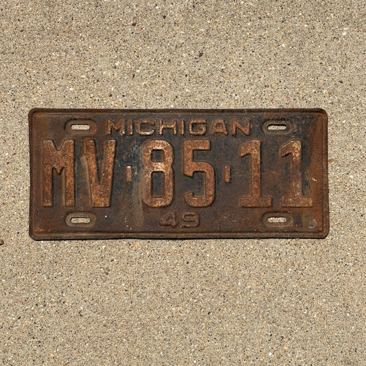Photo of a 1949 Michigan License Plate Auto Tag Garage Decor Vintage MV 85 11 with original patina