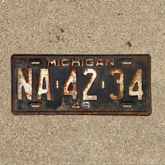 Photo of a 1949 Michigan License Plate Auto Tag Garage Decor Vintage NA 42 34 with original patina