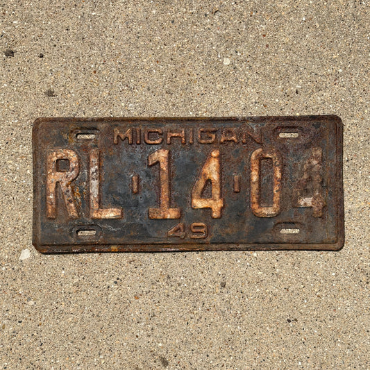 Photo of a 1949 Michigan License Plate Auto Tag Garage Decor Vintage RL 14 04 with original patina