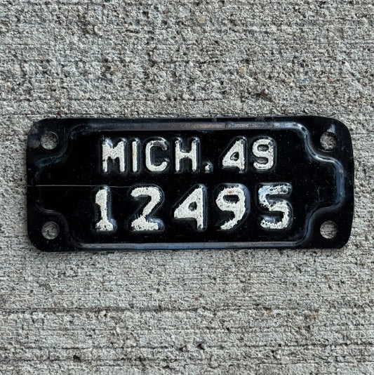 Photo of a 1949 Michigan Motorcycle License Plate Auto Tag Garage Decor Vintage 12495 with original patina