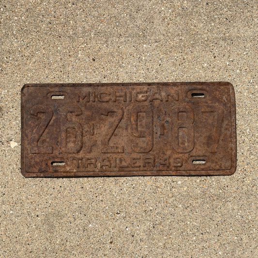 Photo of a 1949 Michigan Trailer License Plate Auto Tag Garage Decor Vintage 26 29 87 with original patina