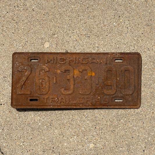 Photo of a 1949 Michigan Trailer License Plate Auto Tag Garage Decor Vintage 26 33 90 with original patina