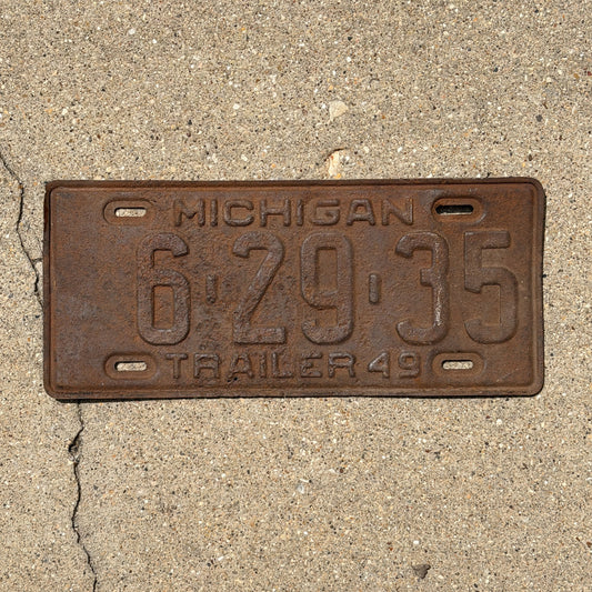 Photo of a 1949 Michigan Trailer License Plate Auto Tag Garage Decor Vintage 6 29 35 with original patina