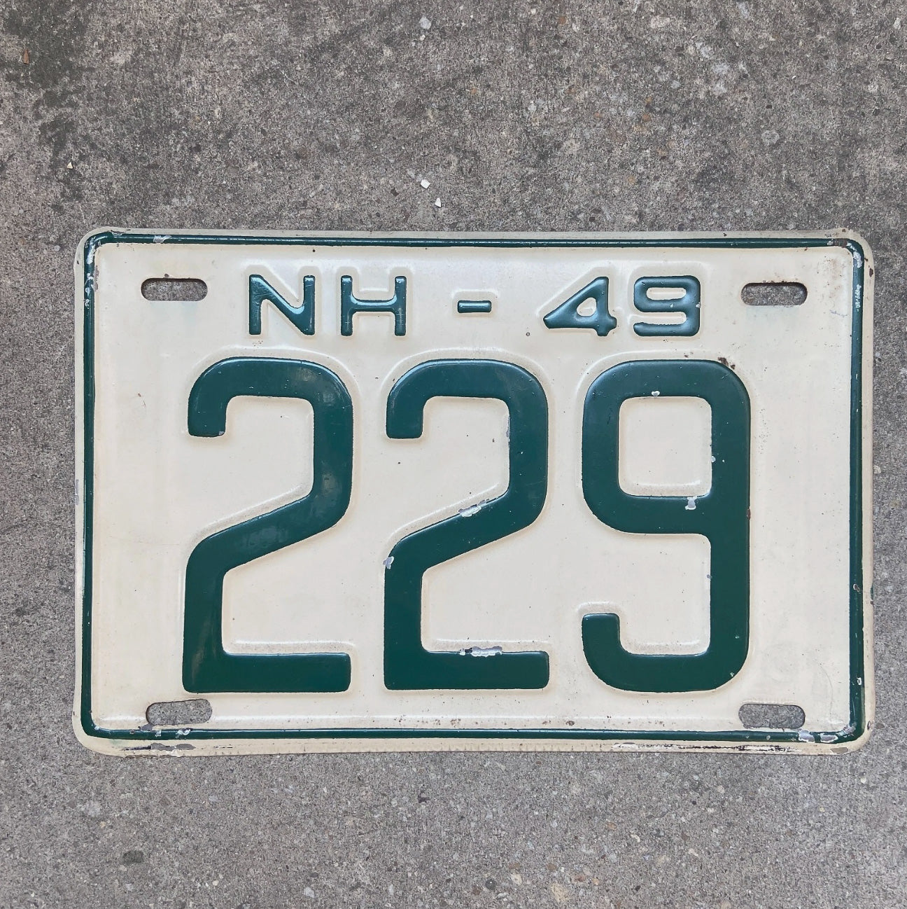 Photo of a 1949 New Hampshire License Plate Auto Tag Garage Decor Vintage Low Number Three Digit 229 with original patina