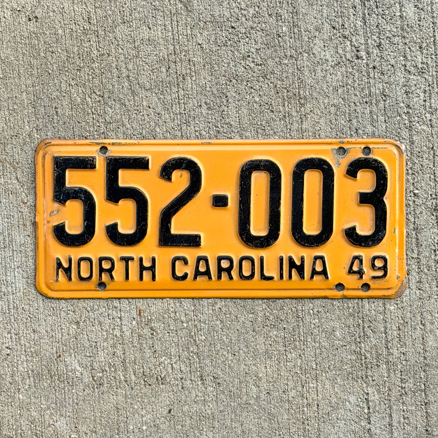Photo of a 1949 North Carolina License Plate Auto Tag Garage Decor Vintage 552 003 with original patina