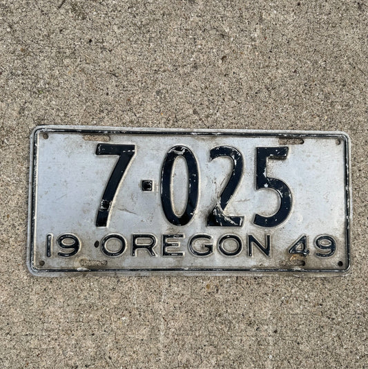Photo of a 1949 Oregon License Plate Auto Tag Garage Decor Vintage Low Number Four Digit 7025 with original patina