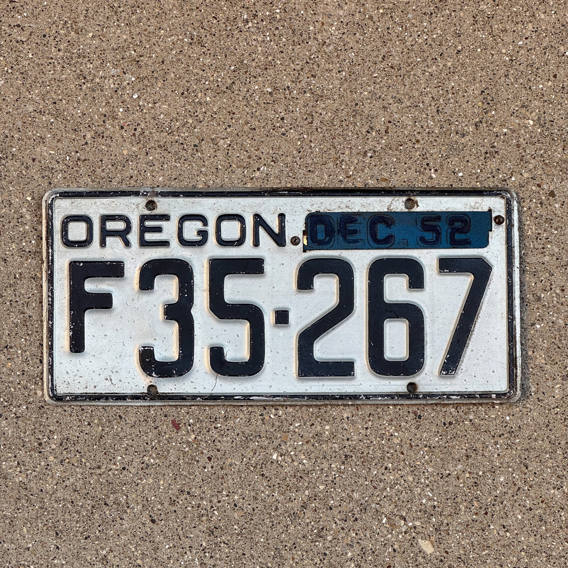 Photo of a 1950 1952 Oregon Farm Truck License Plate Auto Tag Garage Decor Vintage 1952 Year Tab F 35267 with original patina