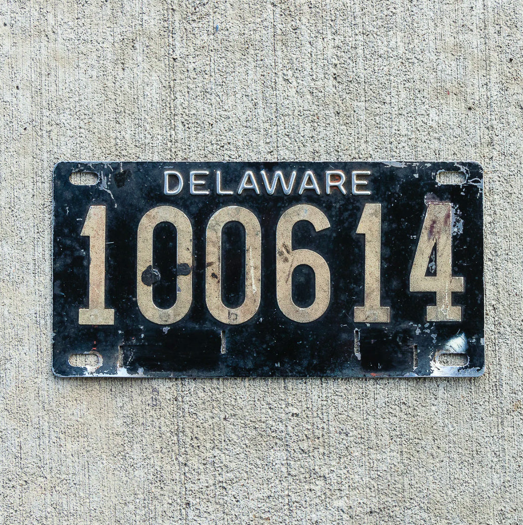 Photo of a 1950 Delaware License Plate Auto Tag Garage Decor Vintage Reflective Riveted Numbers 100614 with original patina