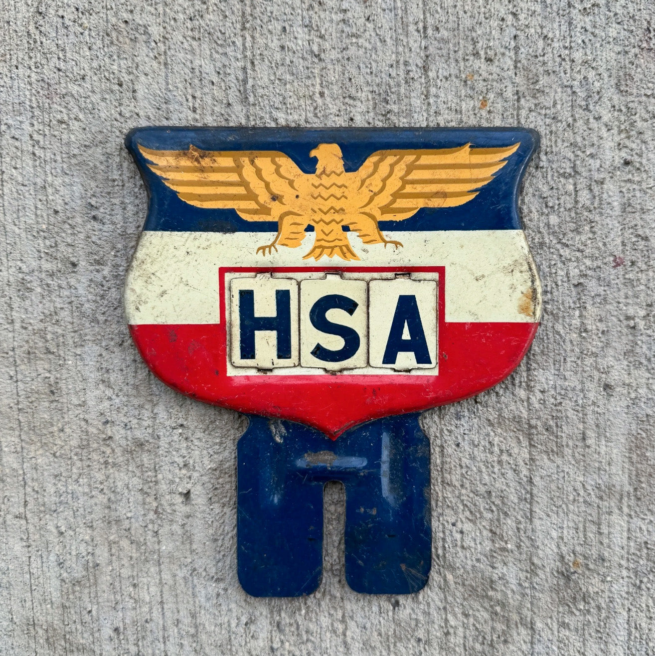 Photo of a 1950 Eagle Flag Shield License Plate Topper Auto Tag Garage Decor Vintage USA Americana American Patriotic HSA with original patina