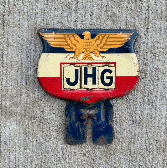 Photo of a 1950 Eagle Flag Shield License Plate Topper Auto Tag Garage Decor Vintage USA Americana American Patriotic JHG with original patina