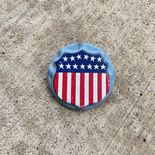 Photo of a 1950 Era American Flag Holder Shield License Plate Topper Auto Tag Garage Decor Vintage USA Americana US Garage with original patina
