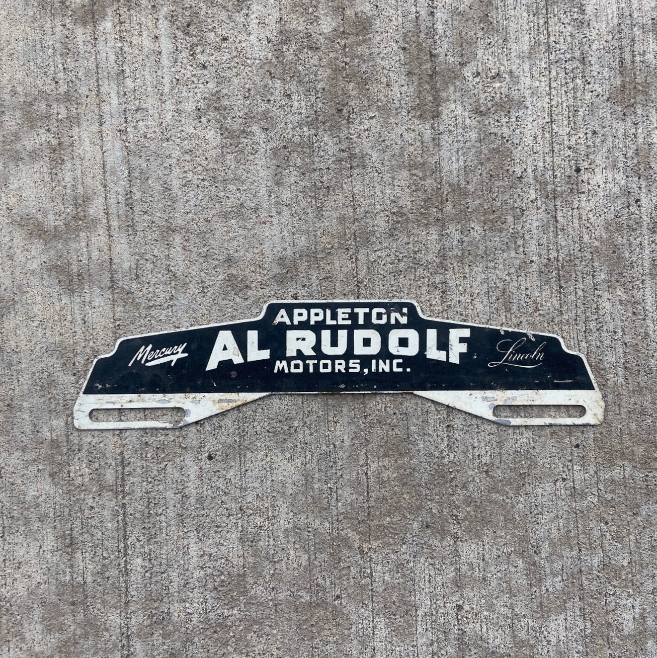 Photo of a 1950 Era Appleton Wisconsin License Plate Topper Auto Tag Garage Decor Vintage Mercury Lincoln Dealer Rudolf with original patina