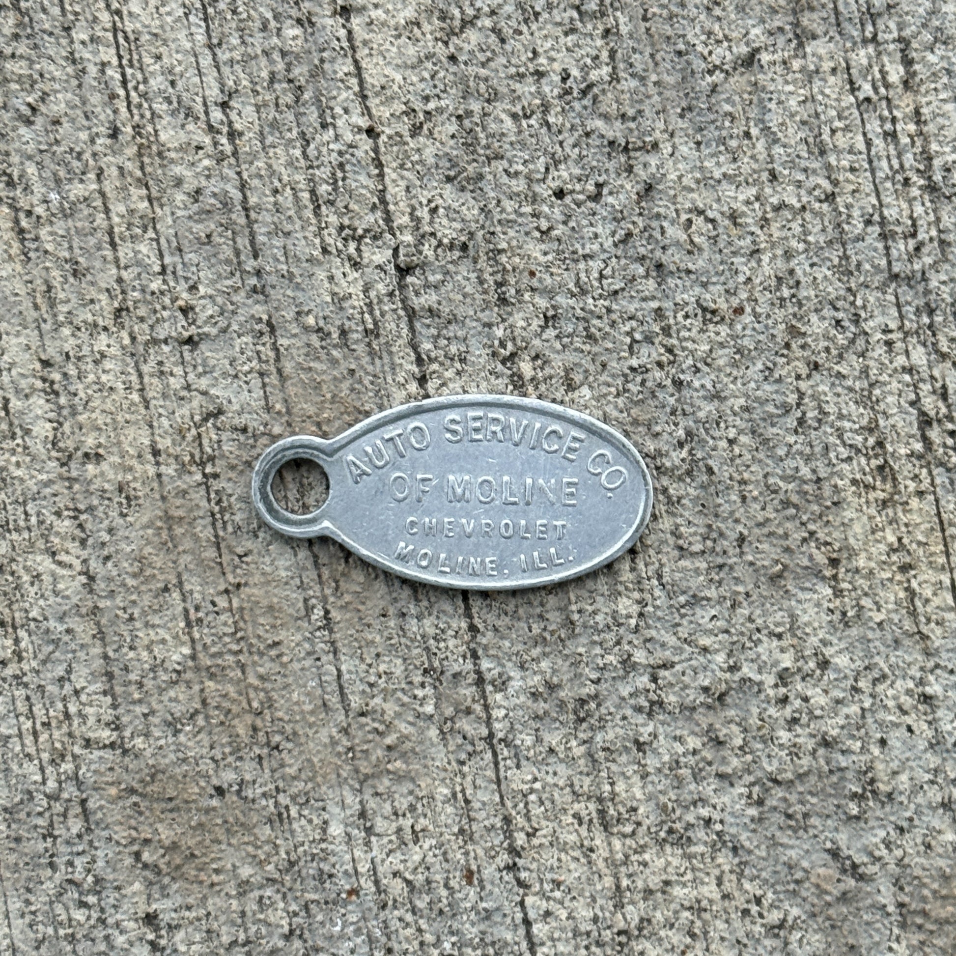 Photo of a 1950 Era Auto Service Co Moline Illinois Keychain Auto Tag Garage Decor Vintage Chevy 288 with original patina